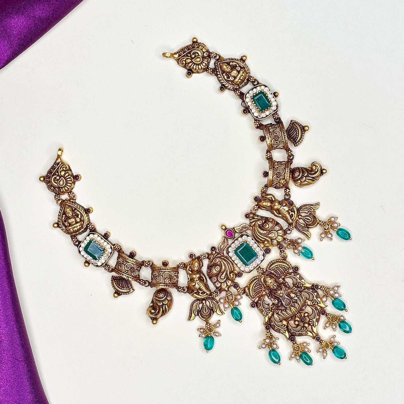 EMERALD ACCENT TEMPLE NECKLACE