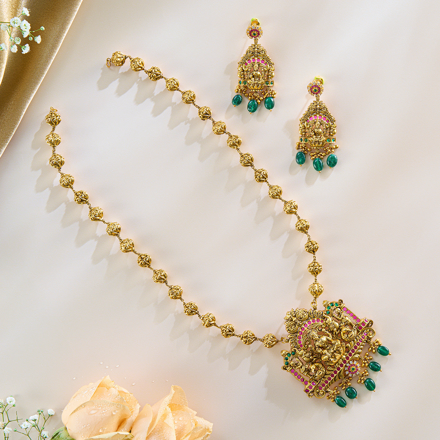 Lakshmi Temple Pendant Set in Antique Gold with Green Drops