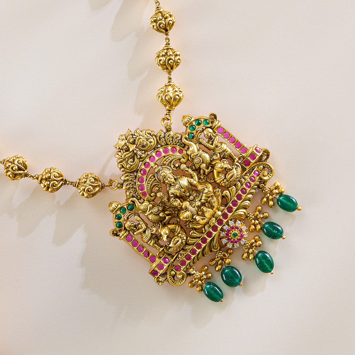 Lakshmi Temple Pendant Set in Antique Gold with Green Drops