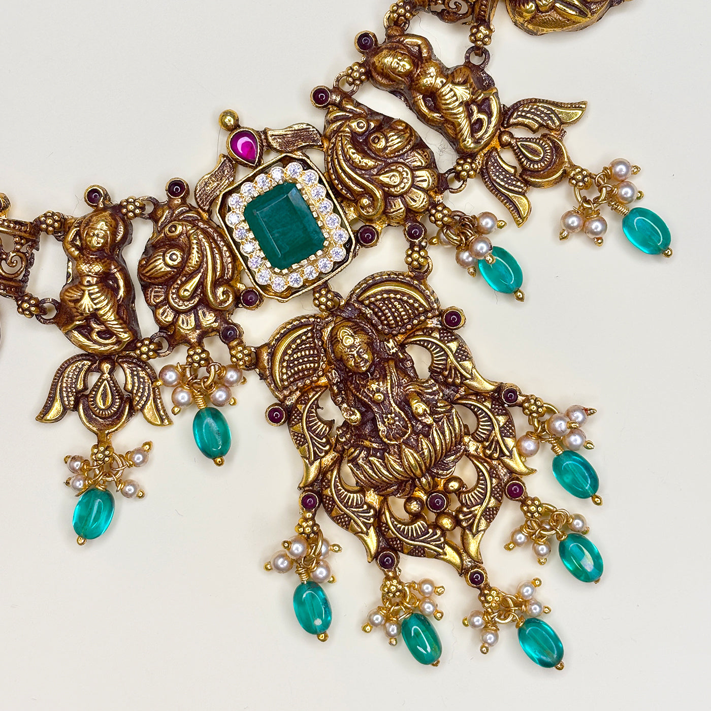 EMERALD ACCENT TEMPLE NECKLACE