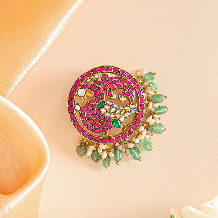 Elegant Peacock Pendant with Pink and Green Flourishes