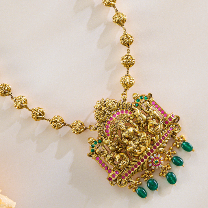 Lakshmi Temple Pendant Set in Antique Gold with Green Drops