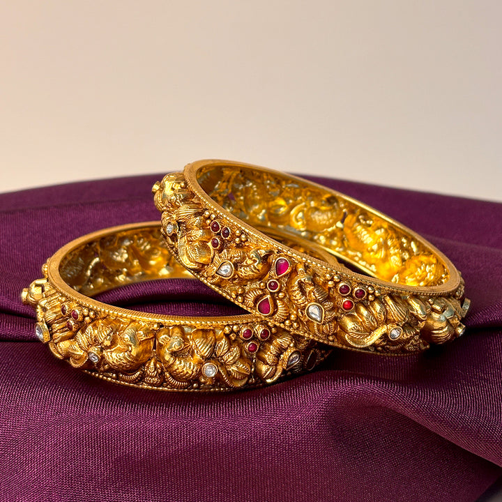 Regal Peacock Bangle with vibrant Gemstone Accents
