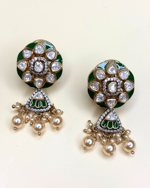 A pair of gold-plated Indian jhumka earrings with green enamel, clear rhinestones.