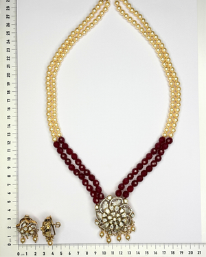 A traditional Indian style necklace and matching earrings set.