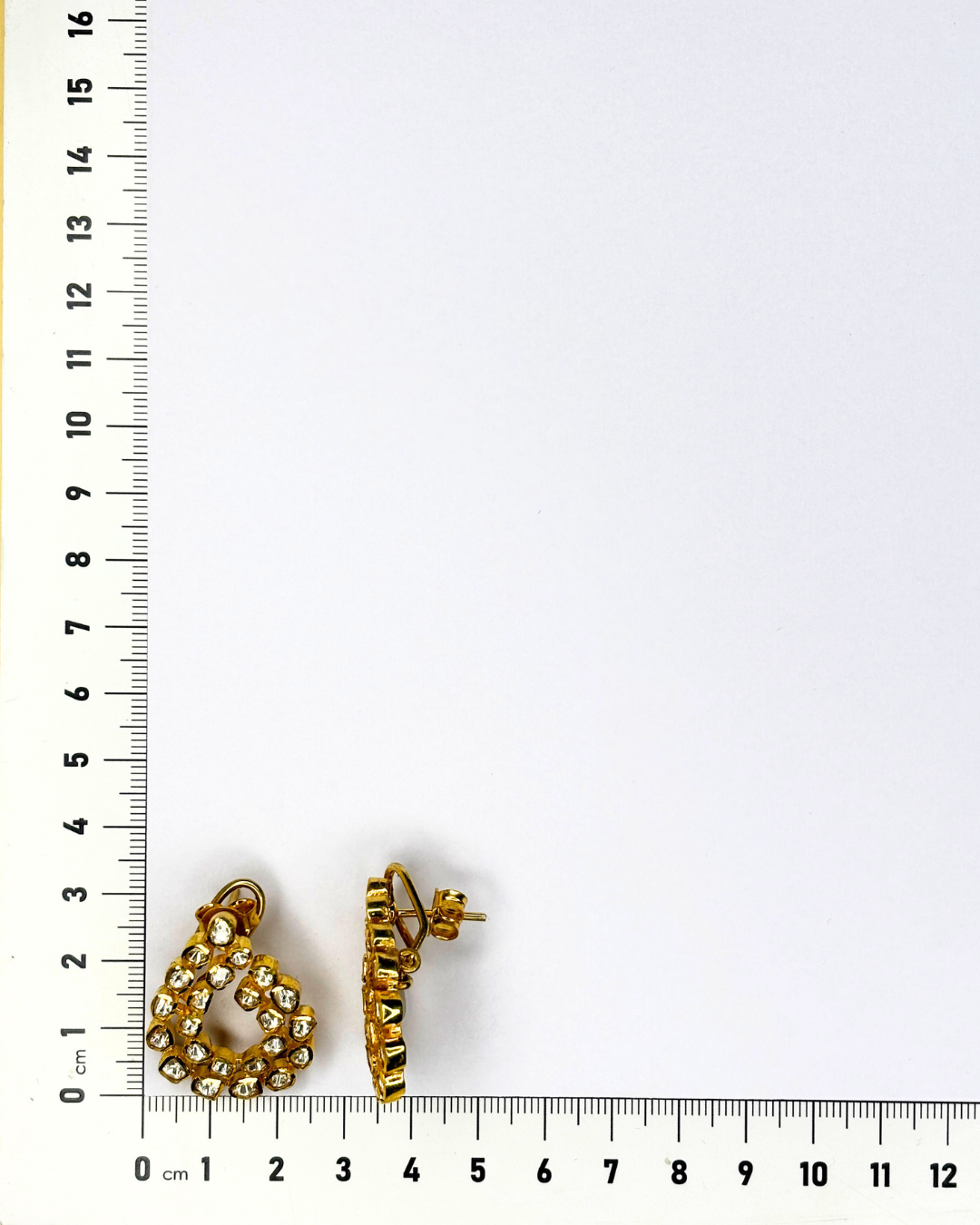 Gold-plated 925 sterling silver hoop earrings with sparkling stones.